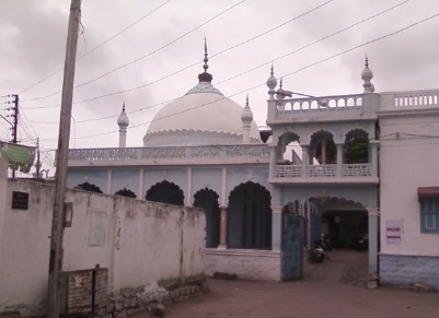 Historical street-level photograph of the dargah complex associated with Hazrat Khwaja Syed Sultan Ali Shah Bukhari in Hyderabad
